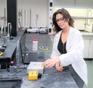 Research scientist performing fluorescence spectroscopy measurements